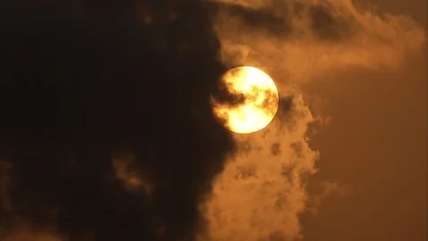 Dark clouds covering the sun at sunset Stockbeeldmateriaal 88887997