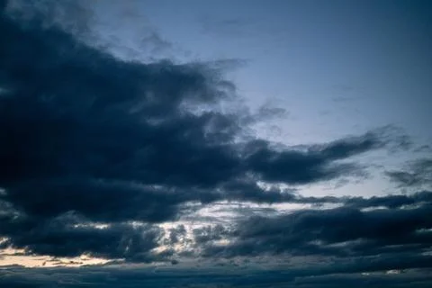Dark clouds with dramatic evening sky at dusk. Stock Photos