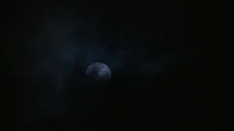 Dark clouds drift over the full moon 스톡 동영상 102863101