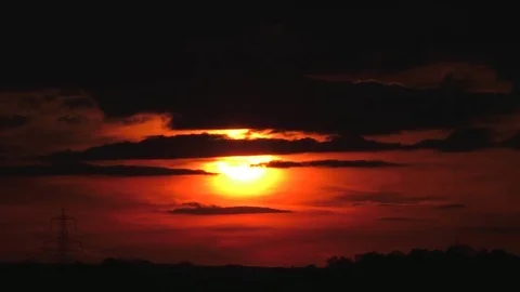 Dark clouds drifting during a golden sunset. timelapse Stock Footage 77576088