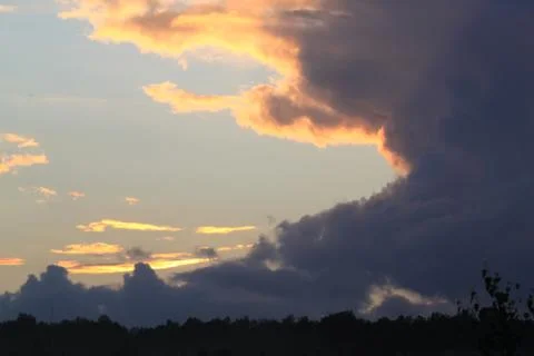 Dark clouds in the evening sky Stock Photos
