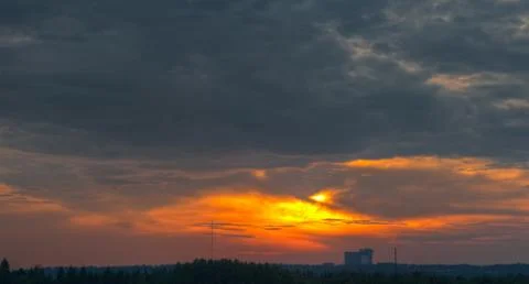Dark clouds on evening sun Stock Photos