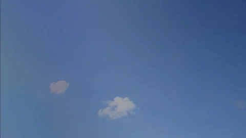 Dark clouds fill a blue sky, 4K/ Stock Footage 157886009