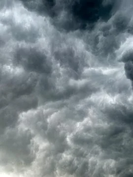 Dark clouds fill the sky before the storm arrives in the afternoon Stock Photos