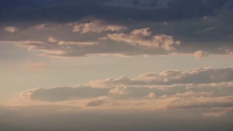 Dark clouds float across the sky in the evening in different directions Stock Footage 131947197