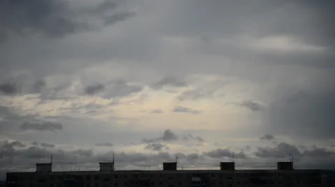 Dark clouds floating over scary city building Stock Footage 67558497