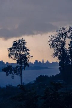 Dark clouds floating on Pasha river Stock Photos