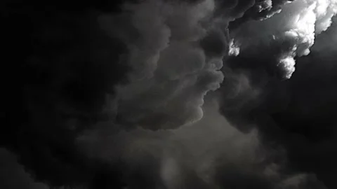 dark clouds floating in the sky with a b... | Stock Video | Pond5