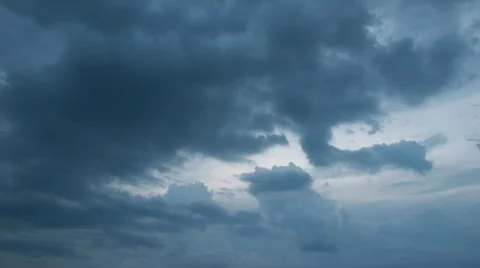 Dark clouds flying on light sky - motion background Stock Footage 798259