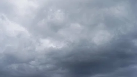 Dark clouds gather overhead as strong winds signal an impending storm Stock Footage 307018471