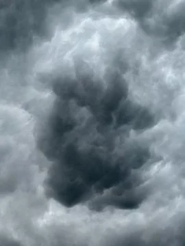 Dark clouds gather in the sky before a storm begins to form Stock Photos