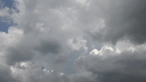 Dark clouds gathering on blue sky Stock Footage 159074318