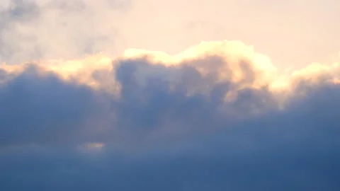 Dark clouds with golden sun beams - sky background with sunrays - Time Lapse Stock Footage 154670945