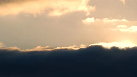Dark clouds with golden sun beams - sky background with sunrays - Time Lapse Stock Footage 154672361