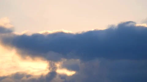 Dark clouds with golden sun beams - sky background with sunrays - Time Lapse Stock Footage 154672413