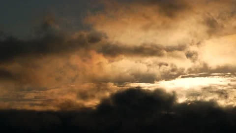 Dark clouds with golden sun beams - sky background, birds, sunrise - real time Stock Footage 154687513