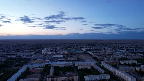 Dark clouds on horizon. Sunset over a small town. Video stock 202632492