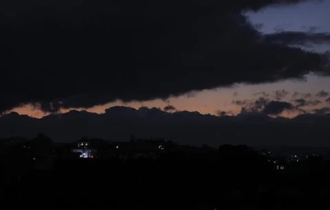 Dark clouds hover over Sana'a, Sanaa, Yemen - 18 Dec 2025 Fotos Stock