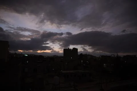 Dark clouds hover over Sana'a, Sanaa, Yemen - 18 Dec 2025 Fotos Stock