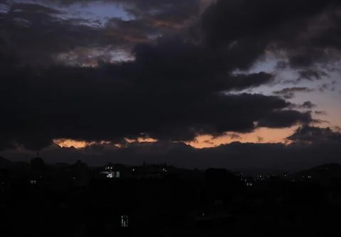Dark clouds hover over Sana'a, Sanaa, Yemen - 18 Dec 2025 Fotos Stock