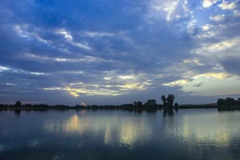 Dark clouds on the lake Stock Photos