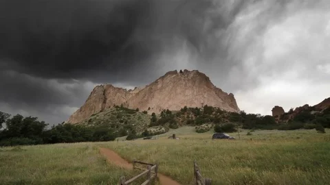 Dark Clouds Looming over Garden of the Gods Mountains Stock Footage 78017925