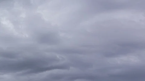 Dark clouds move across the blue sky Stock Footage 87326823