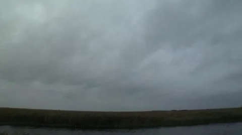 Dark Clouds Move over Marsh, the Everglades Florida Video Vídeo Stock 12761493