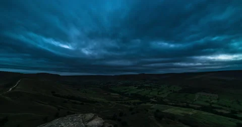 Dark clouds moving over mountains and valley time lapse in 4K 스톡 동영상 65990108