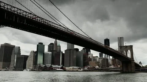 Dark clouds moving in over New York City downtown Brooklyn Bridge timelapse 24P Video stock 11143972