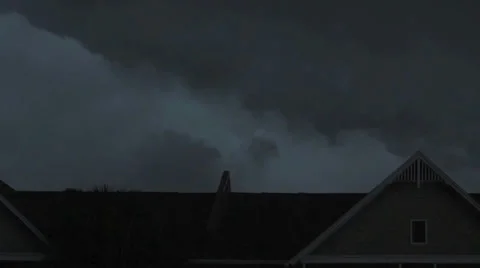 Dark clouds moving over a rooftop Stock-Footage 35482213