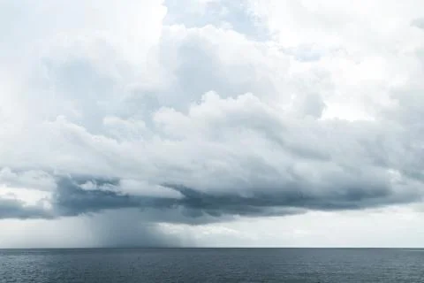 Dark clouds in open ocean Stock Photos