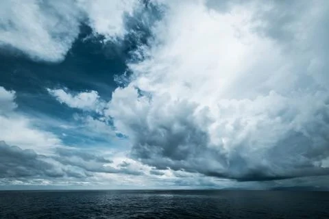Dark clouds in open ocean Stock Photos