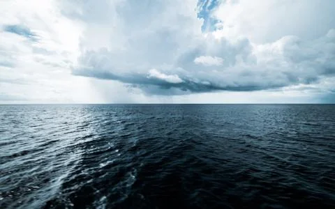 Dark clouds in open ocean Stock Photos