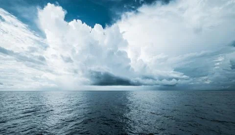 Dark clouds in open ocean Stock Photos