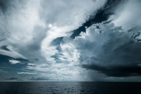 Dark clouds in open ocean Stock Photos