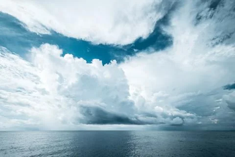 Dark clouds in open ocean Stock Photos