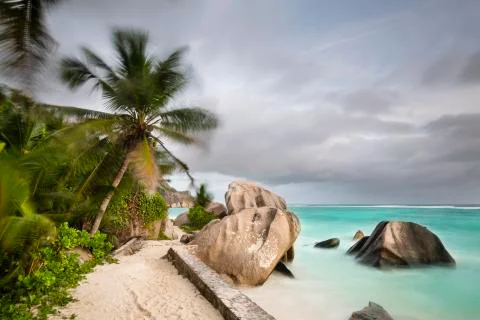 Dark clouds over the beach Anse Source D'Argent in La Digue, Seychelles with  Stock Photos