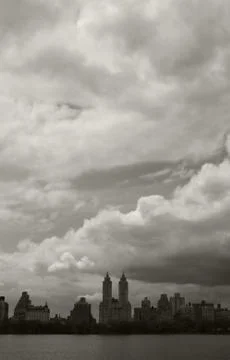 Dark clouds over central park reservoir Stock Photos