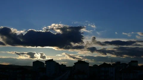 Dark clouds over a city, clouds over a city at sunset 動画素材 104511524