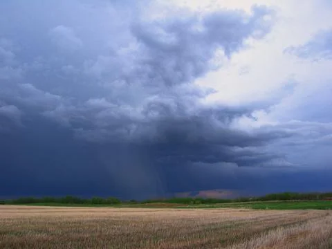 Dark Clouds Over Field Foto stock