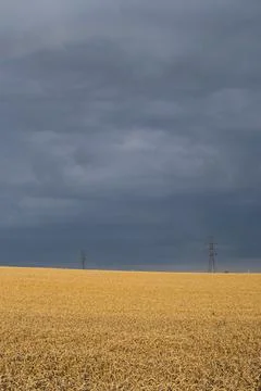 Dark clouds over fields Foto stock