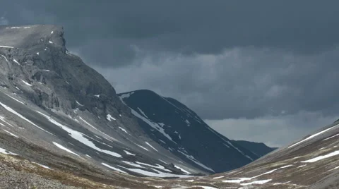 Dark clouds over the gloomy rocks horizontal move Video stock 64823068