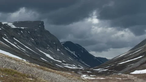 Dark clouds over the gloomy rocks zoom in Stock-Footage 67513294