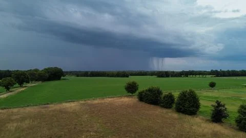 Dark clouds over the landscape, just before a thunderstorm, arial view Stock Photos