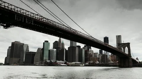 Dark clouds over Manhattan Brooklyn Bridge New York City tilt down 24P Stock Footage 11137801