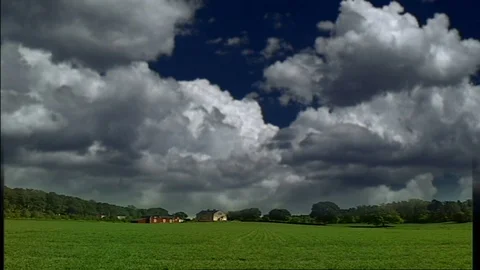 DARK CLOUDS OVER MEADOW Stock-Footage 97238699