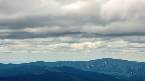 Dark clouds over mountain forest time lapse Stock Footage 69823259