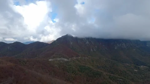 Dark clouds over the mountains Stock Footage 153512644