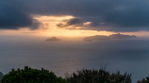 Dark clouds over ocean coast at golden sunrise in summer morning Time lapse Stock Footage 116898875